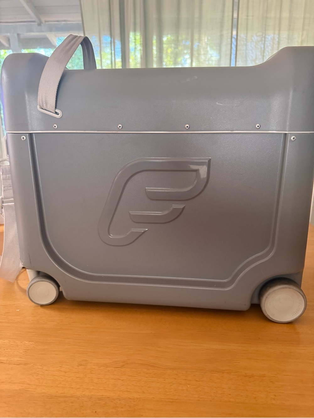 Jetset Kids by “Stokke” ride on suitcase - Gray